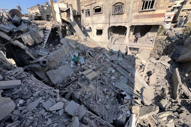 Palestinians inspect the damage outside a building destroyed by an Israeli bombardment in Beit Lahia in the northern Gaza Strip on November 7, 2024. (Photo: AFP)