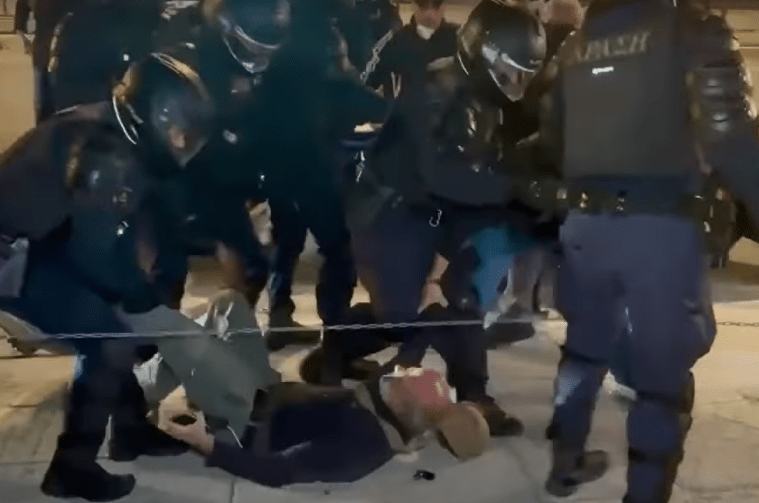 Riot police dragg Giorgos Androutsou along the ground during a protest by firefighters in the capital Athens on October 31, 2024.