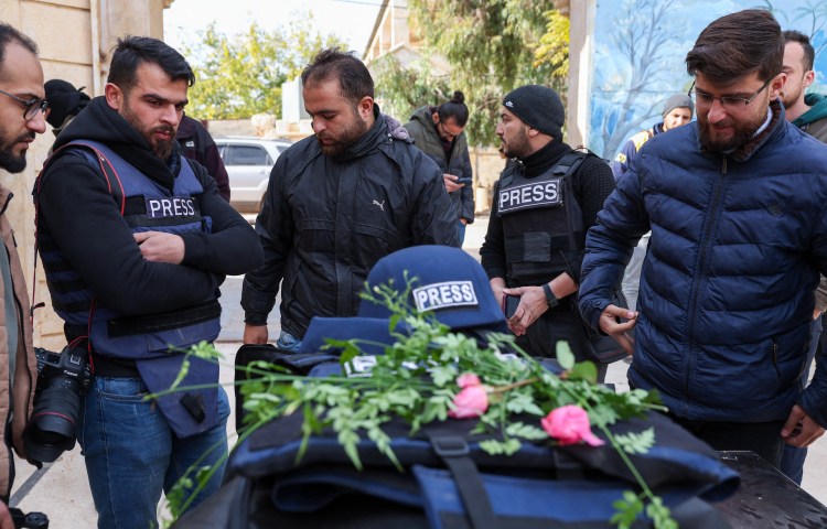 Mourners gather at the funeral of Syrian photojournalist Anas Alkharboutli in Syria's northern city of Idlib on December 4, 2024. Alkharboutli was killed in an air strike near the Syrian city of Hama on December 3, his employer said. (Photo: AFP/Omar Haj Kadour)