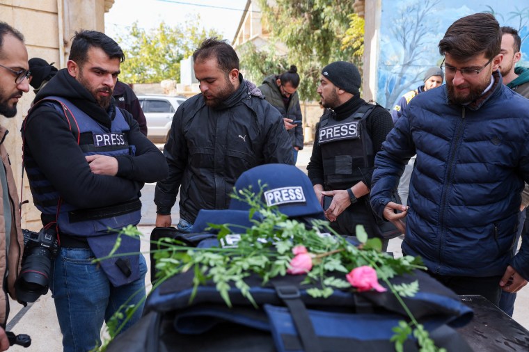 Mourners gather at the funeral of Syrian photojournalist Anas Alkharboutli in Syria's northern city of Idlib on December 4, 2024. Alkharboutli was killed in an air strike near the Syrian city of Hama on December 3, his employer said. (Photo: AFP/Omar Haj Kadour)