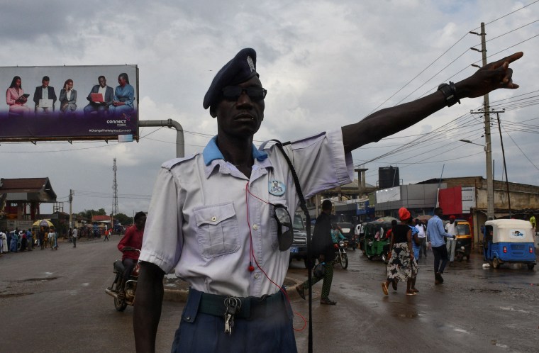 A traffic police officer gestures directing motorists along a street, following a night of gunfire after security forces moved to arrest the former head of the intelligence service, in Juba, South Sudan November 22, 2024. REUTERS/Samir Bol