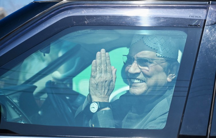 Pakistan's President Asif Ali Zardari gestures from a car in Nawabshah on February 8, 2024. (Photo: AFP)