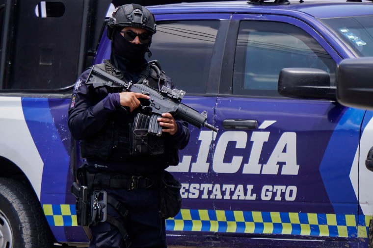 A police officer guards the funeral site of Mexican journalist Alejandro Martinez Noguez in Celaya City, Mexico, on August 5, 2024. Unidentified attackers shot and killed another reporter, Calletano de Jesús Guerrero, in Teoloyucan on January 17, 2024. (Photo: AFP/Mario Armas)