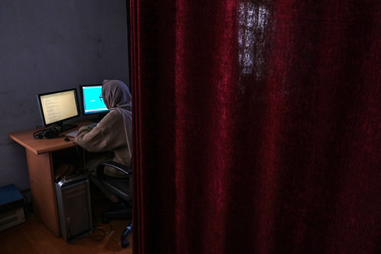 This picture taken on November 28, 2021, shows a woman working at Radio Begum in Kabul, Afghanistan. Taliban agents raided the station on February 4, 2025, suspended broadcast operations, and detained two media workers. (Photo: AFP/Hector Retamal)