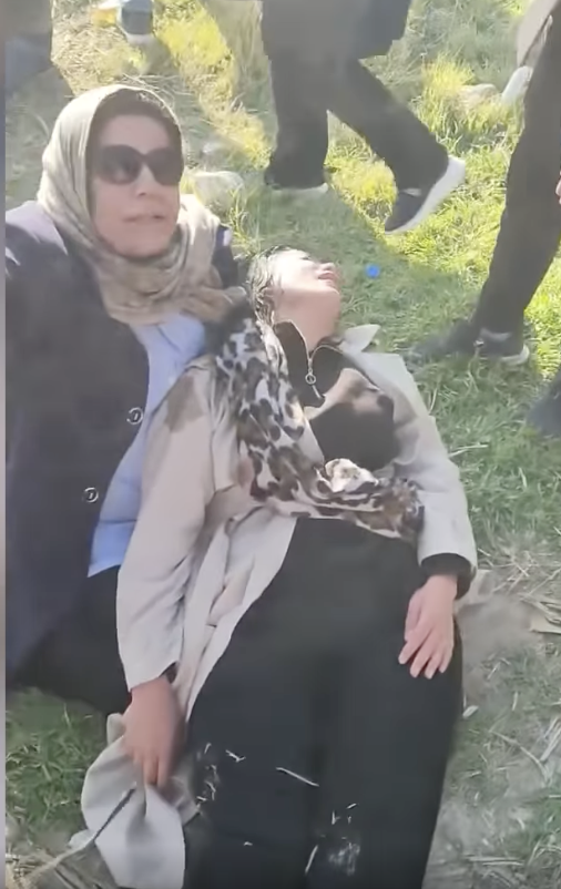 Diplomatic’s reporter Zhilya Ali is seen lying on another woman's lap after being teargassed.