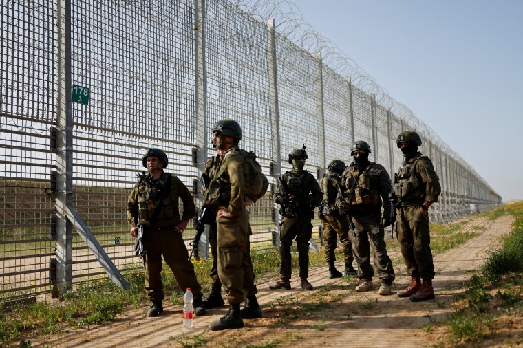 Soldiers guard the Israel-Gaza border fence in Israel on March 18, 2025. (Photo: Reuters/Amir Cohen)