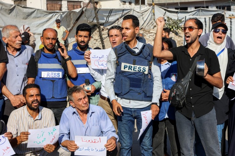 Demonstrators and journalists protest against hunger in Gaza City on July 19.